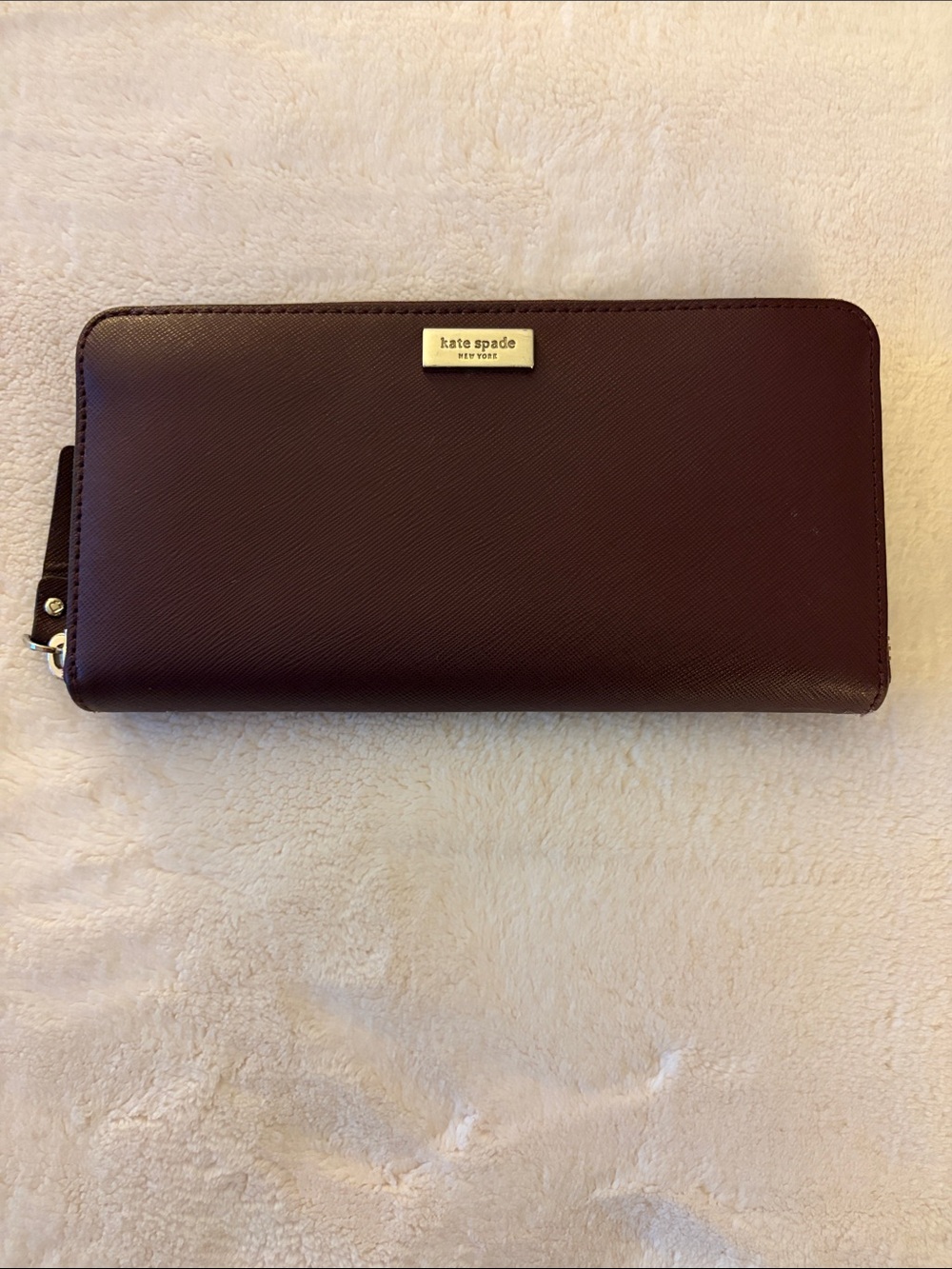 kate spade burgundy saffiano zip-around wallet with gold plaque